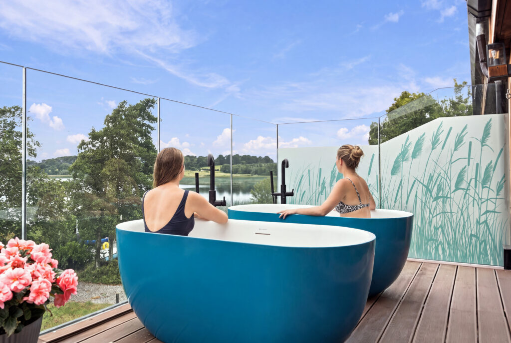 Relax in luxurious rooftop baths with stunning lake views, surrounded by nature and privacy at our exclusive hotel.